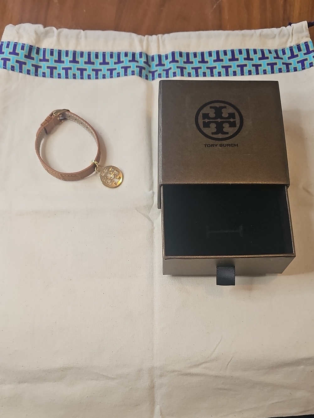 Tory Burch Dust Bag With Tan Leather Bracelet with Gold Logo Charm